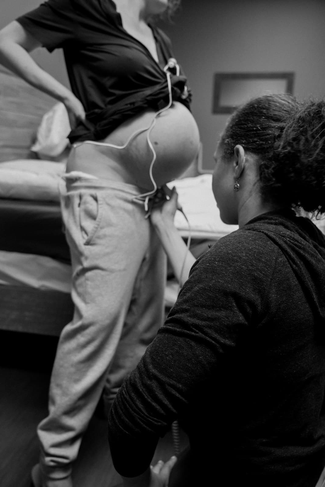 A midwife performing a prenatal checkup at Transitions Birth Center